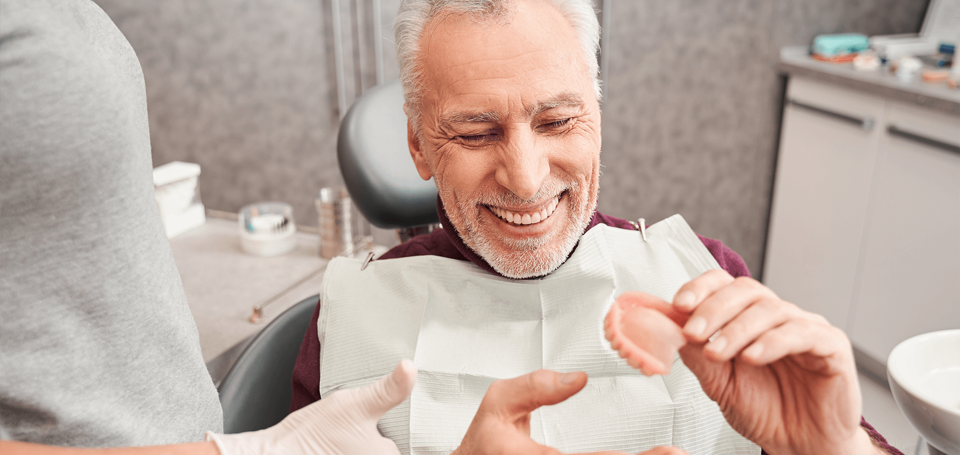 A patient smiling at her dentist