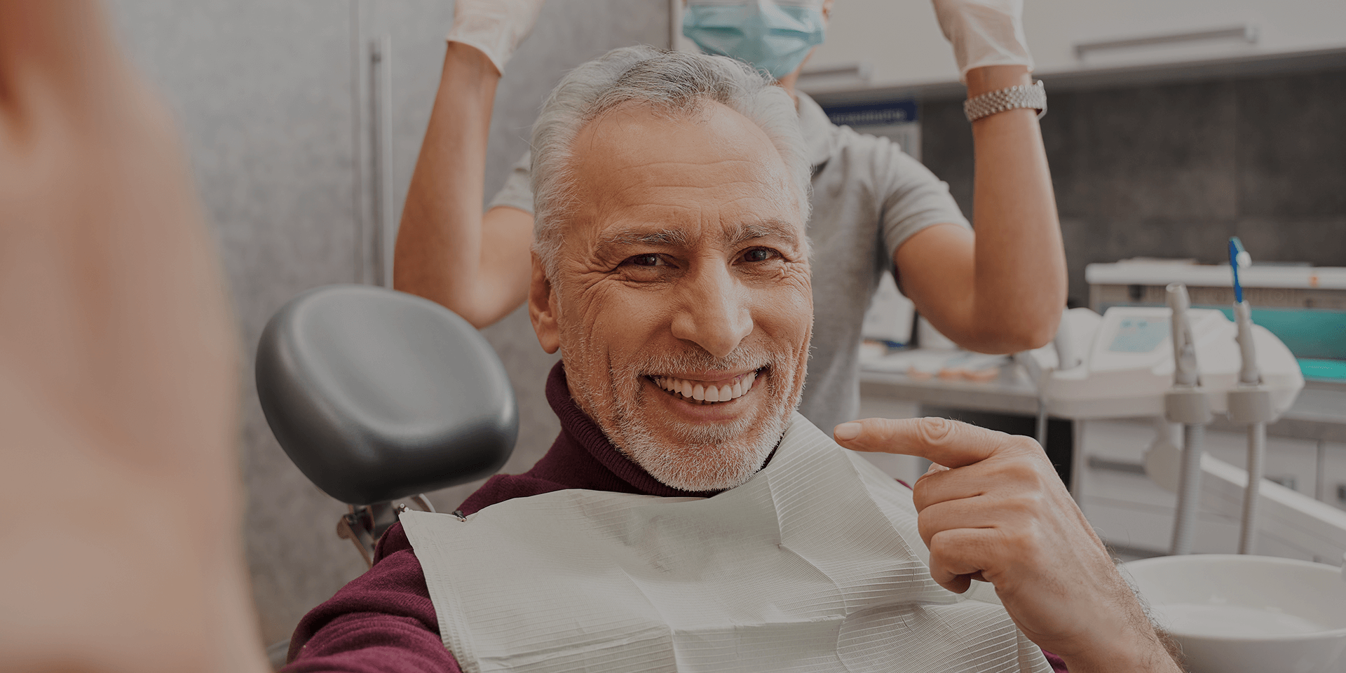 An older man smiling.