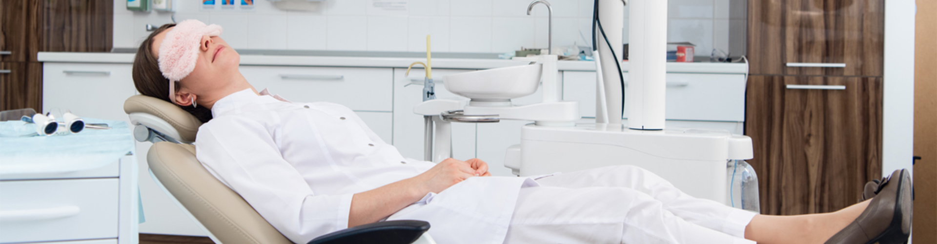 Patient sleeping in dentist char