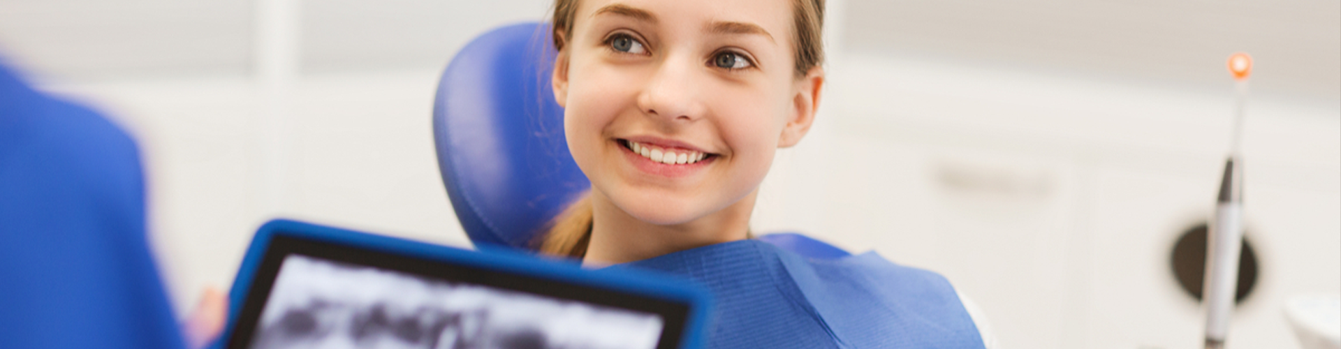 young girl smiling for x-rays