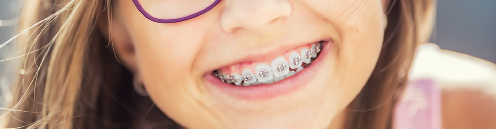 Young girl smiling with braces