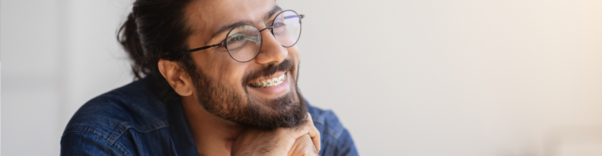 Man with braces smiling