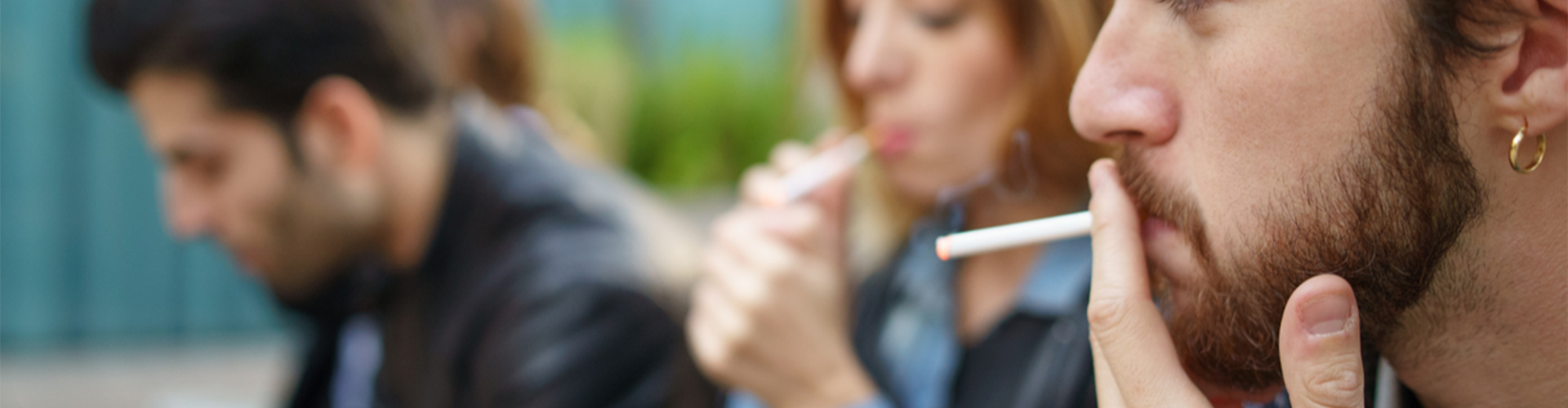 man and woman smoking cigarettes 
