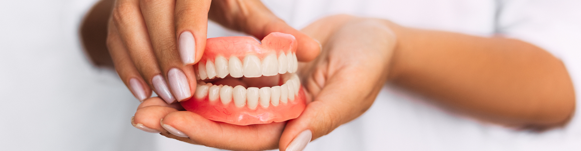 Dentures in hands