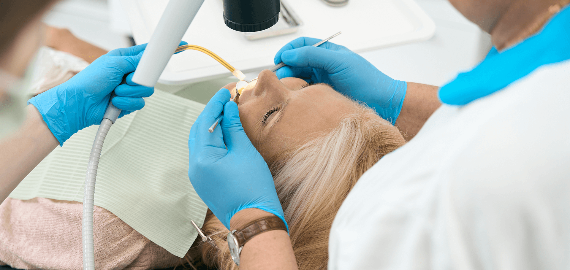 A patient receiving treatment from a dentist.